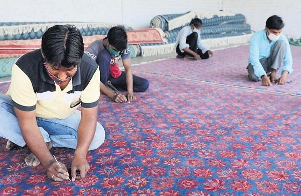 900 craftsmen behind carpets for new Parliament building-
