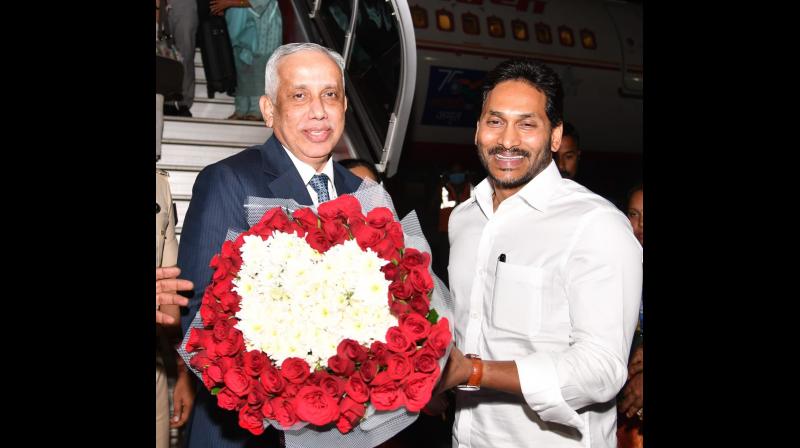 Chief Minister Y.S. Jagan Mohan Reddy along with senior members of the AP Govt welcomed Governor-Designate Justice (Retd.) S. Abdul Nazeer and his family members to the state on Thursday. (Photo: Twitter @RajivKrishnaS)