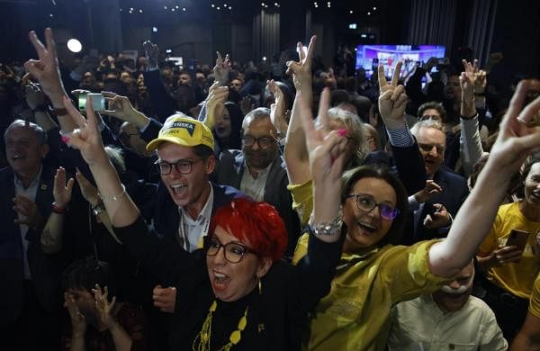 Poles vote in huge numbers for the centrist opposition after 8 years of nationalist rule-